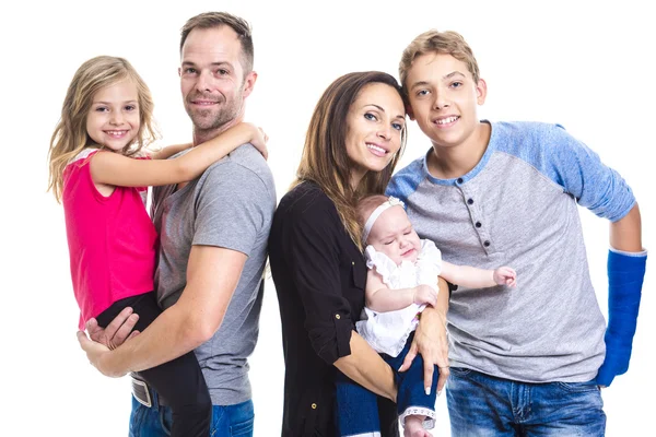 Prachtige familie op studio witte achtergrond — Stockfoto