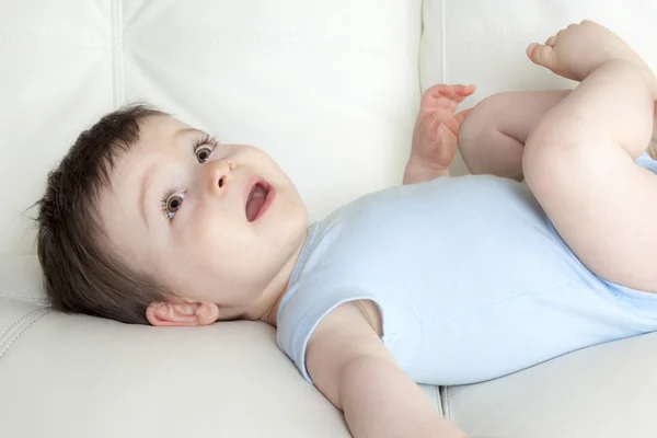 Baby boy relaxing in sofa at home — Stock Photo, Image