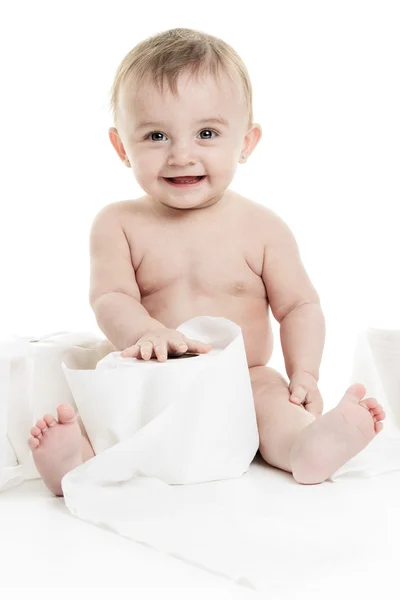 Toddler ripping up toilet paper in bathroom studio — Stock Photo, Image