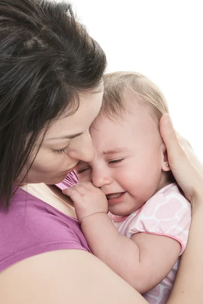 Mother trying to calm her crying baby