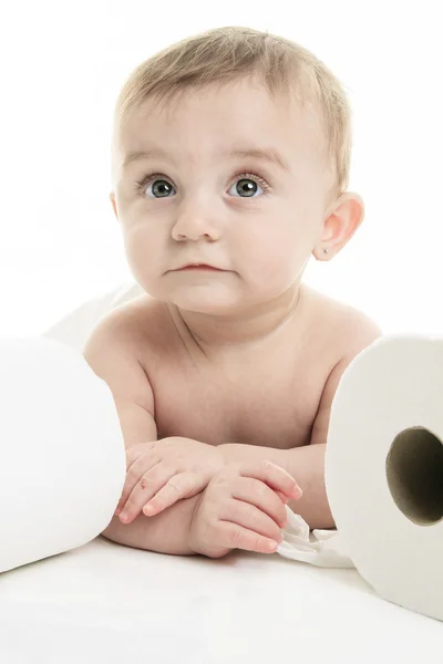 Toddler ripping up toilet paper in bathroom studio — Stock Photo, Image