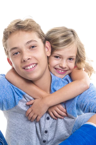 Beautiful children teenager boy with is young sister — Stock Photo, Image