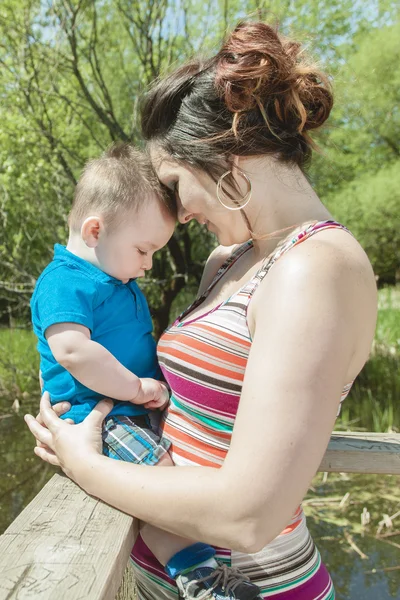 Beautiful mother and little baby boy in forest — Stock Photo, Image