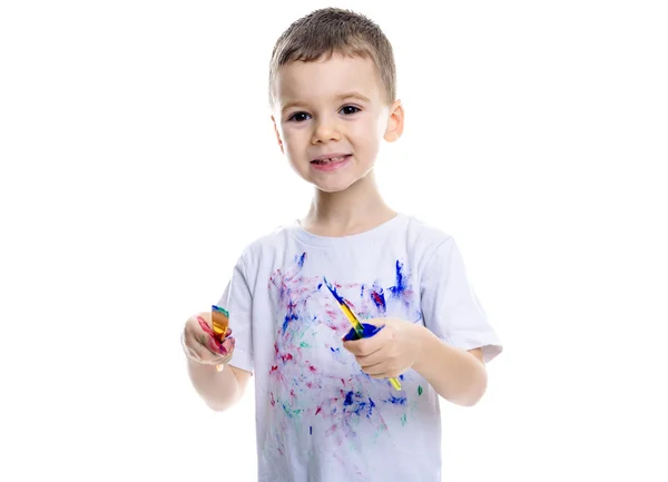 Retrato de niño pequeño con pinturas en las manos aisladas sobre fondo blanco — Foto de Stock