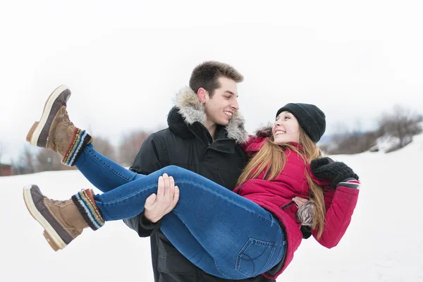 Two teenagers havinf fun on the snow field — Stock Photo, Image