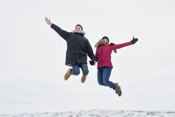 Two teenagers havinf fun on the snow field — Stock Photo, Image