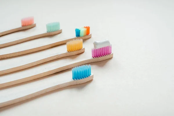 Multicolored eco friendly bamboo toothbrushes, dental care with zero waste concept, sustainable lifestyle — Stock Photo, Image