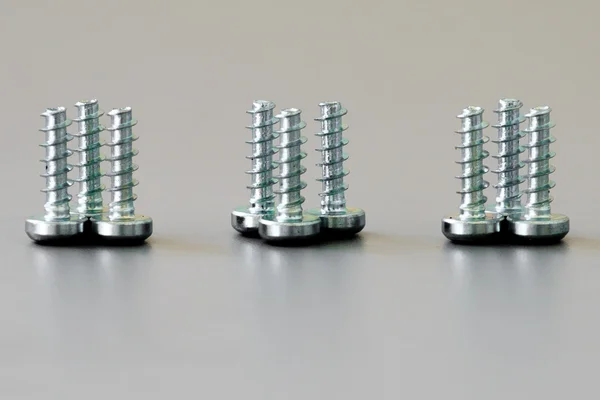 Nine screws close up — Stock Photo, Image