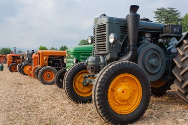 Old tractors in perspective clipart