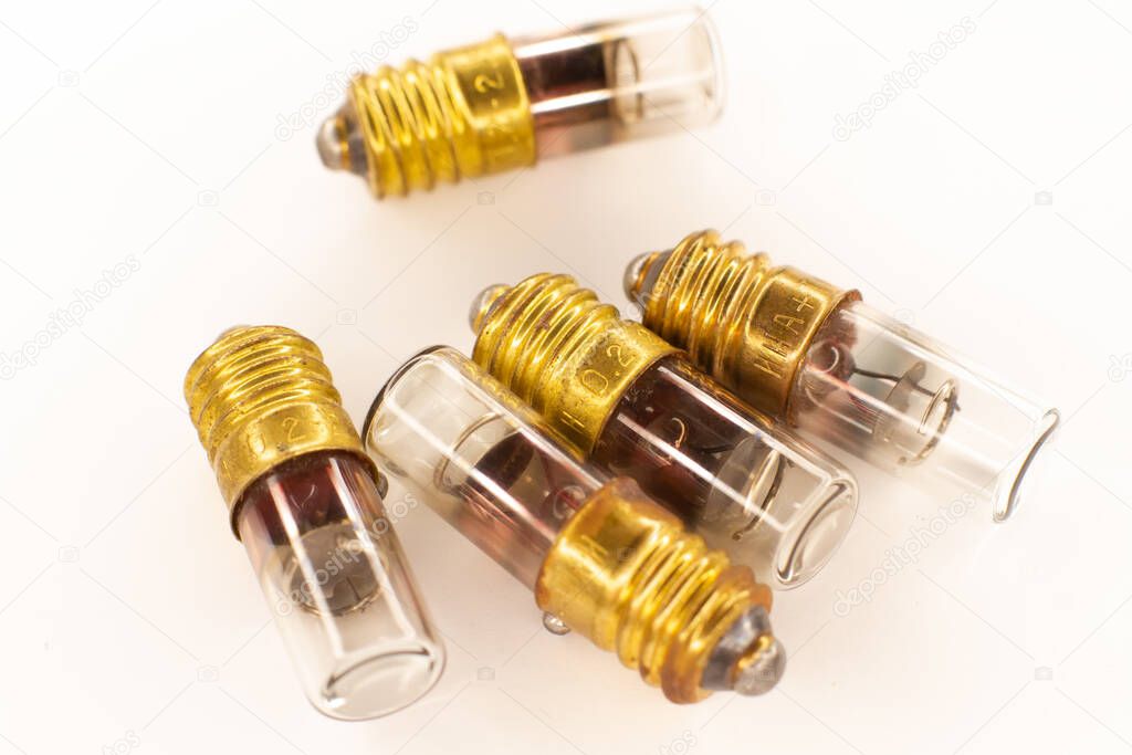 Small old vacuum glass light bulbs with a filament. Radio components.