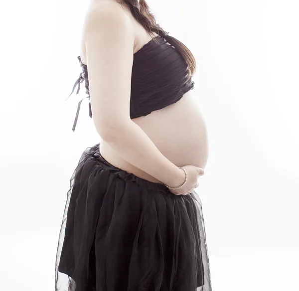 En gravid mamma i vit bakgrund — Stockfoto