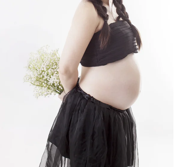 Uma mãe grávida em fundo branco — Fotografia de Stock