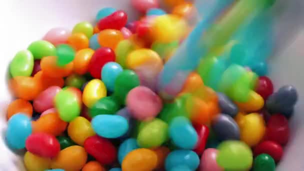 Jelly Beans Poured Into Bowl — Stock Video