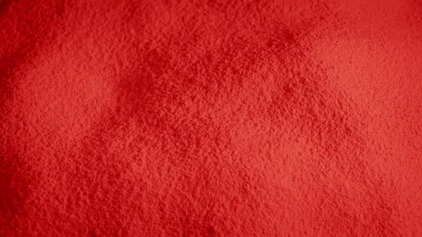 Material Rojo Polvo Que Gira Lentamente — Vídeos de Stock