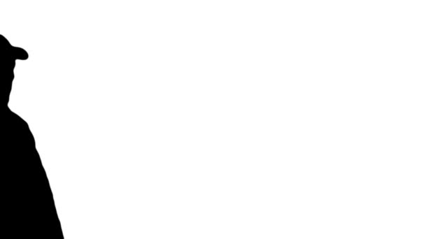 Silhouette garde marche passé et utilise la radio 