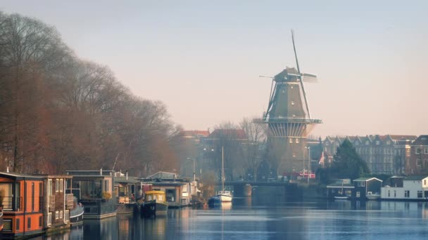 Windmill Overlooking Pretty Canal Area — Stock Video