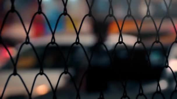 City Nightlife Through Fence Abstract — Stock Video