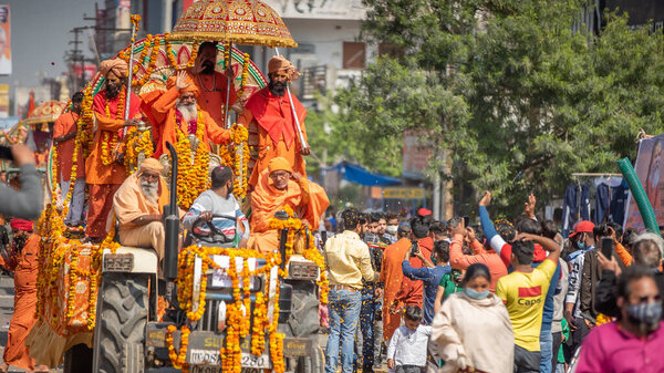Indian sadhus coming to Kumbh Mela, Royal welcome. Sadhus sitting wearing garland