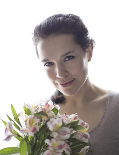 Girl holding the flowers — Stock Photo, Image