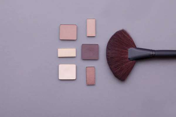Beautiful makeup on a gray background. — Stock Photo, Image