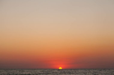 Peace and quiet on the seashore at sunset.