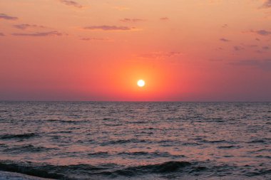 Peace and quiet on the seashore at sunset.