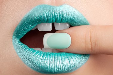 Lips close-up and manicure.