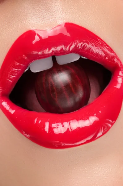 Red lips with a cherry. — Stock Photo, Image