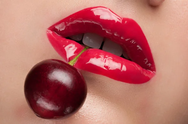 Red lips with a cherry. — Stock Photo, Image