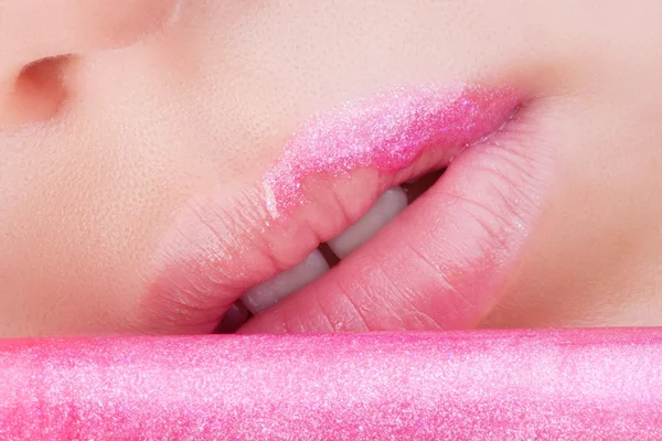 Lips with pink glitter.