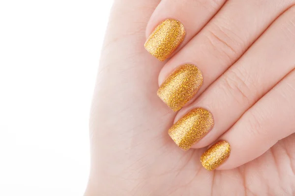 Piękny złoty manicure. — Zdjęcie stockowe