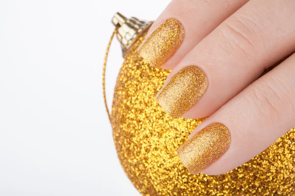 Beautiful golden manicure. — Stock Photo, Image