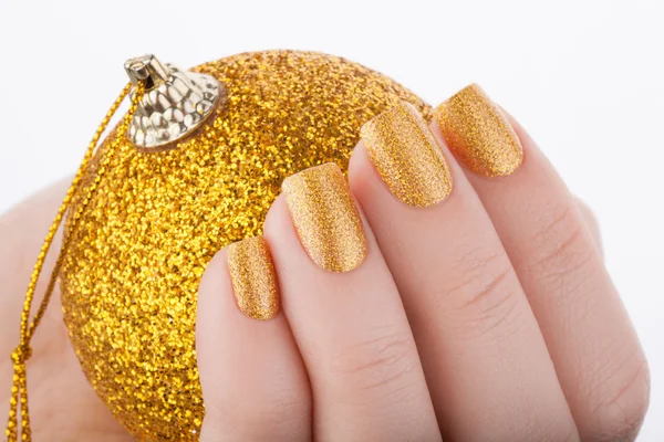 Beautiful golden manicure. — Stock Photo, Image