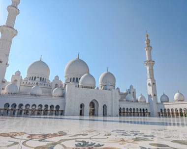 Sheikh Zayed Grand Mosque in Abu Dhabi, United Arab Emirates. One of largest mosques in the world. White marble domes and columns