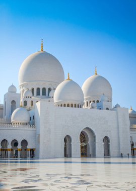 Sheikh Zayed Grand Mosque in Abu Dhabi, United Arab Emirates. One of largest mosques in the world. White marble domes and columns