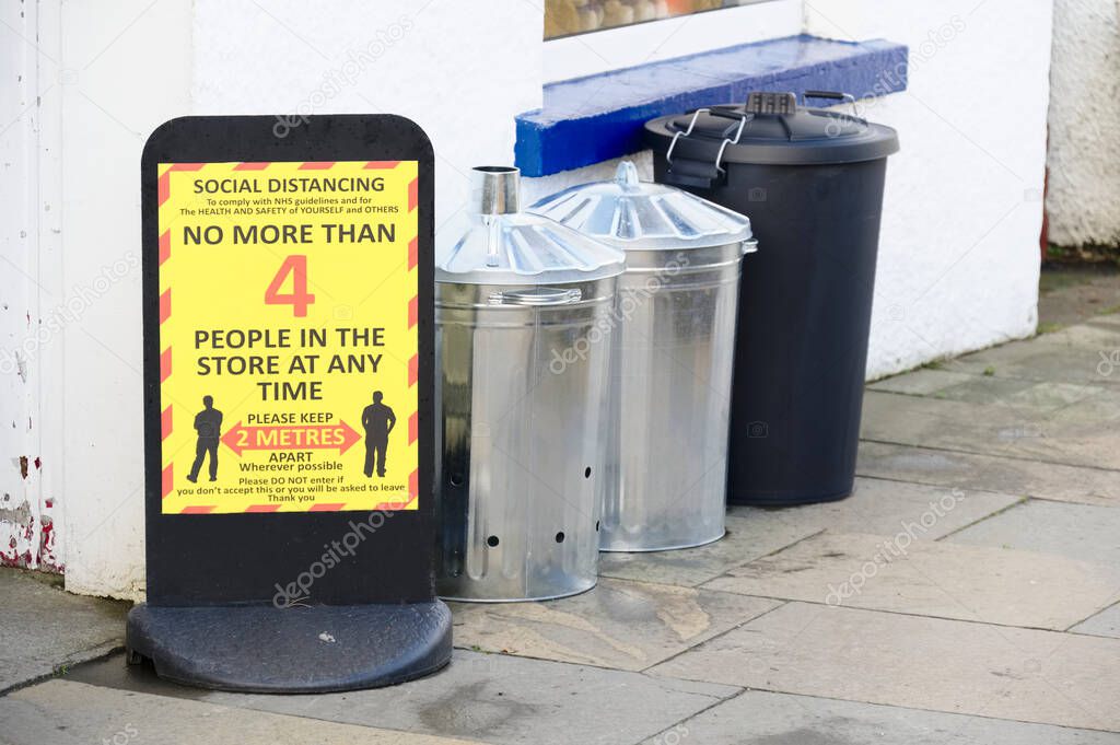 Social distancing sign shop customers to respect and stay safe UK