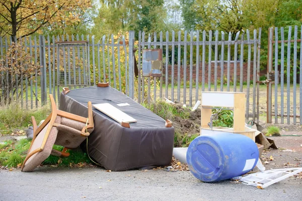 Poor council flats with fly tipping of rubbish outdoors Inverclyde Scotland