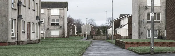 Port Glasgow 'da sosyal yardım sorunları olan fakir gecekondu mahallesindeki kimsesizler konağı.