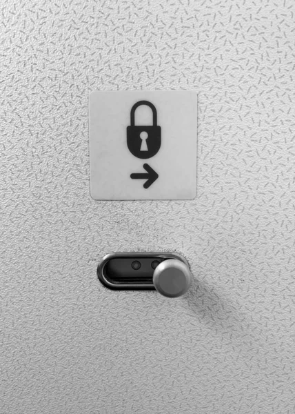Airplane cabin lavatory lock door sign and door latch to lock and unlock.