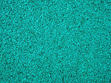 Oyun alanı için esnek turkuaz fayans. Plastik kırıntıların karışımından yapılmış fayanslar..