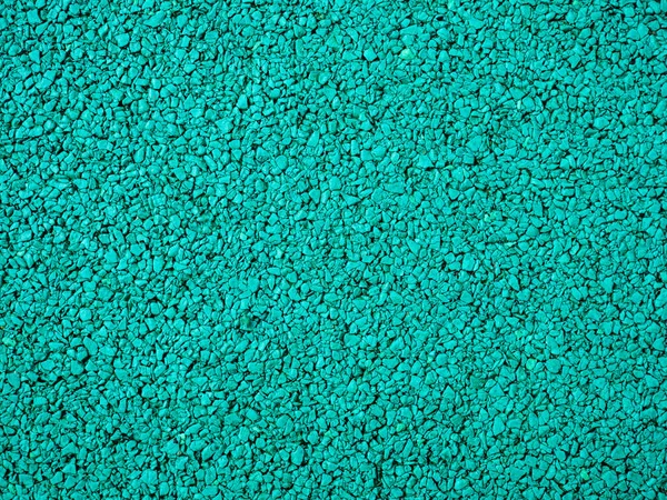 Flexible turquoise tile for playground. Tiles made from a mixture of rubber crumb. — стоковое фото