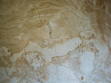 Açık kahverengi içerikli bej mermer arkaplan.