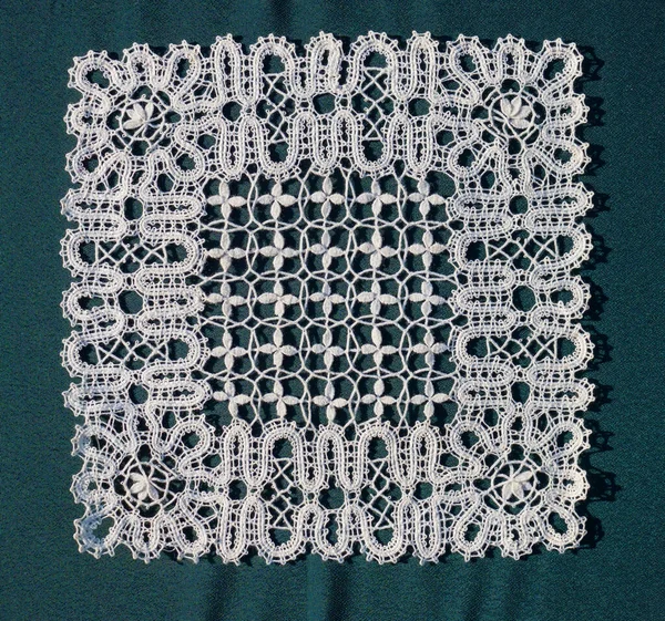 Russian lace is a bobbin tape lace. The designs of Russian lace are of abstract form — Stock Photo, Image