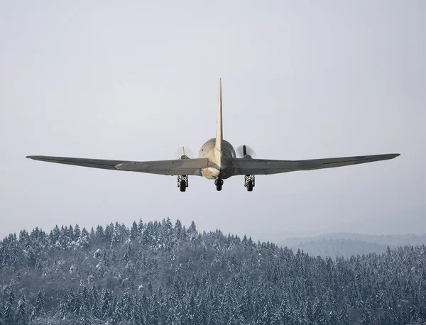 Flying plane in winter — Stock Photo, Image