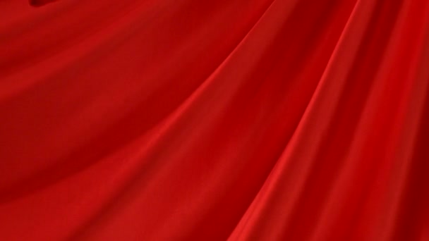 Present falls onto red fabric — Stock Video