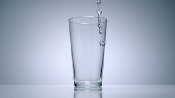 Water pouring in a glass — Stock Video