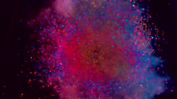 Les particules colorées volent après l'explosion 