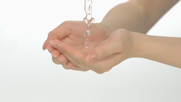 Water pouring in woman's hands — Stock Video