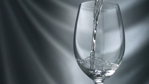 Pouring white wine into glass — Stock Video