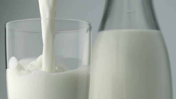 Pouring milk into glass — Stock Video